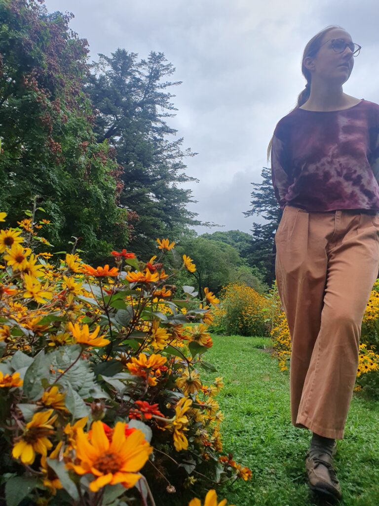 Devon surrounded by rudbeckia flowers